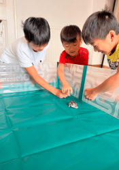 Children playing with their hamster in the Omlet hamster playpen.